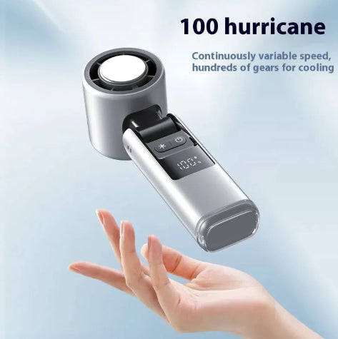 Handheld device with digital display and cooling function, held in a hand against a light blue background.