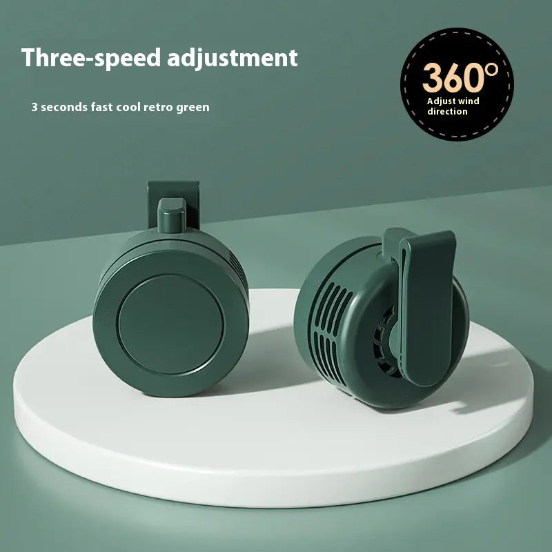 Two green fans on a white platform with text about three-speed adjustment and 360-degree wind direction.